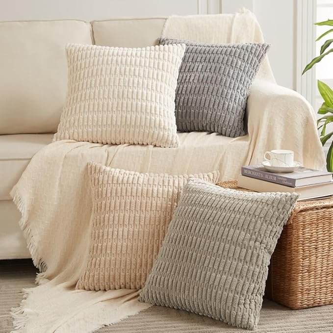 A set of colorful throw pillow covers arranged on a couch