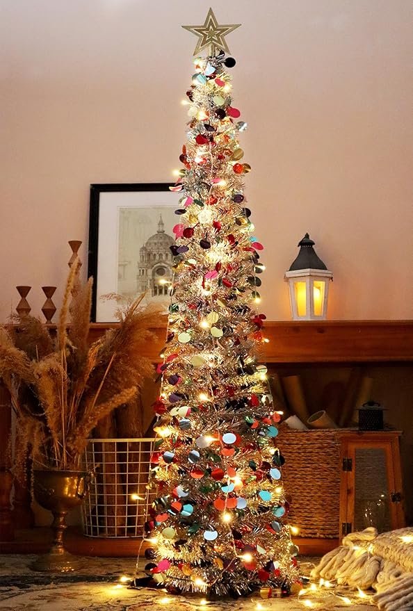 A beautifully lit pop-up Christmas tree in a cozy living room setting