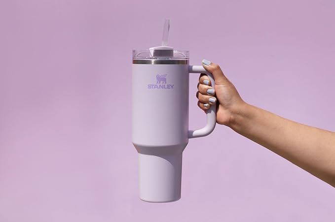 A woman's hand holding a stylish tumbler as a gift for Christmas