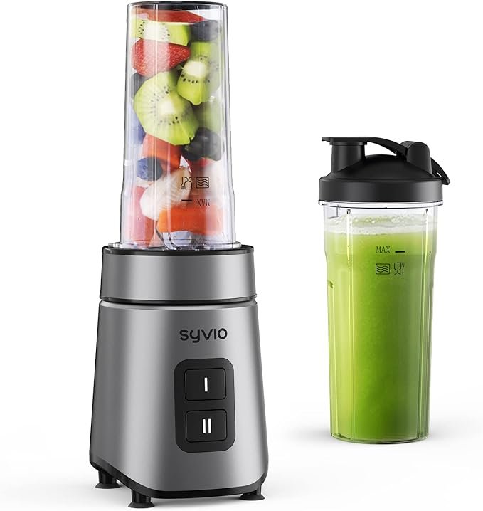 The Syvio 600W personal smoothie blender on a kitchen countertop with a glass of fresh smoothie next to it