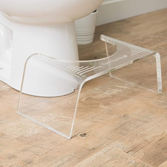 Acrylic Toilet Stool placed beside a toilet for comfort and support