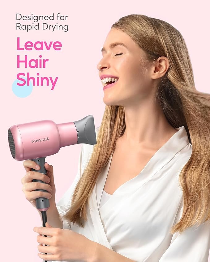 a beautiful woman holding a pink hair dryer